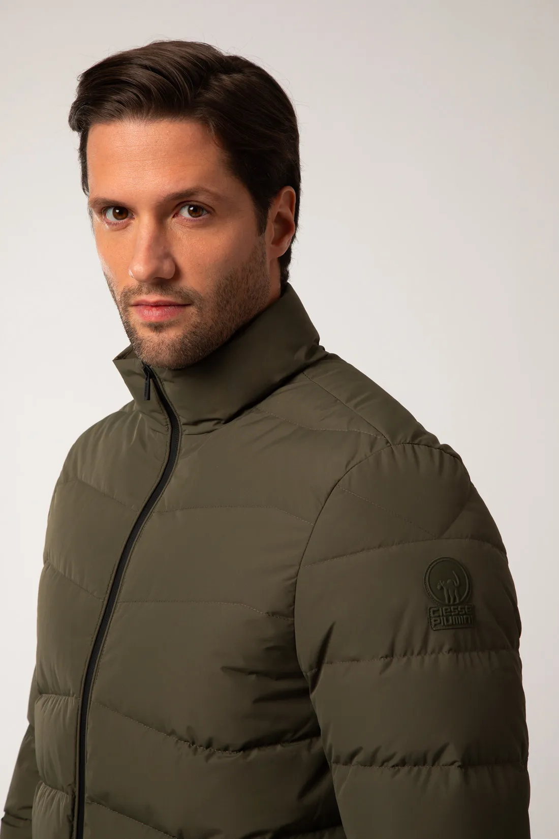 AKRON – Piumino verde full zip con filze a zig zag