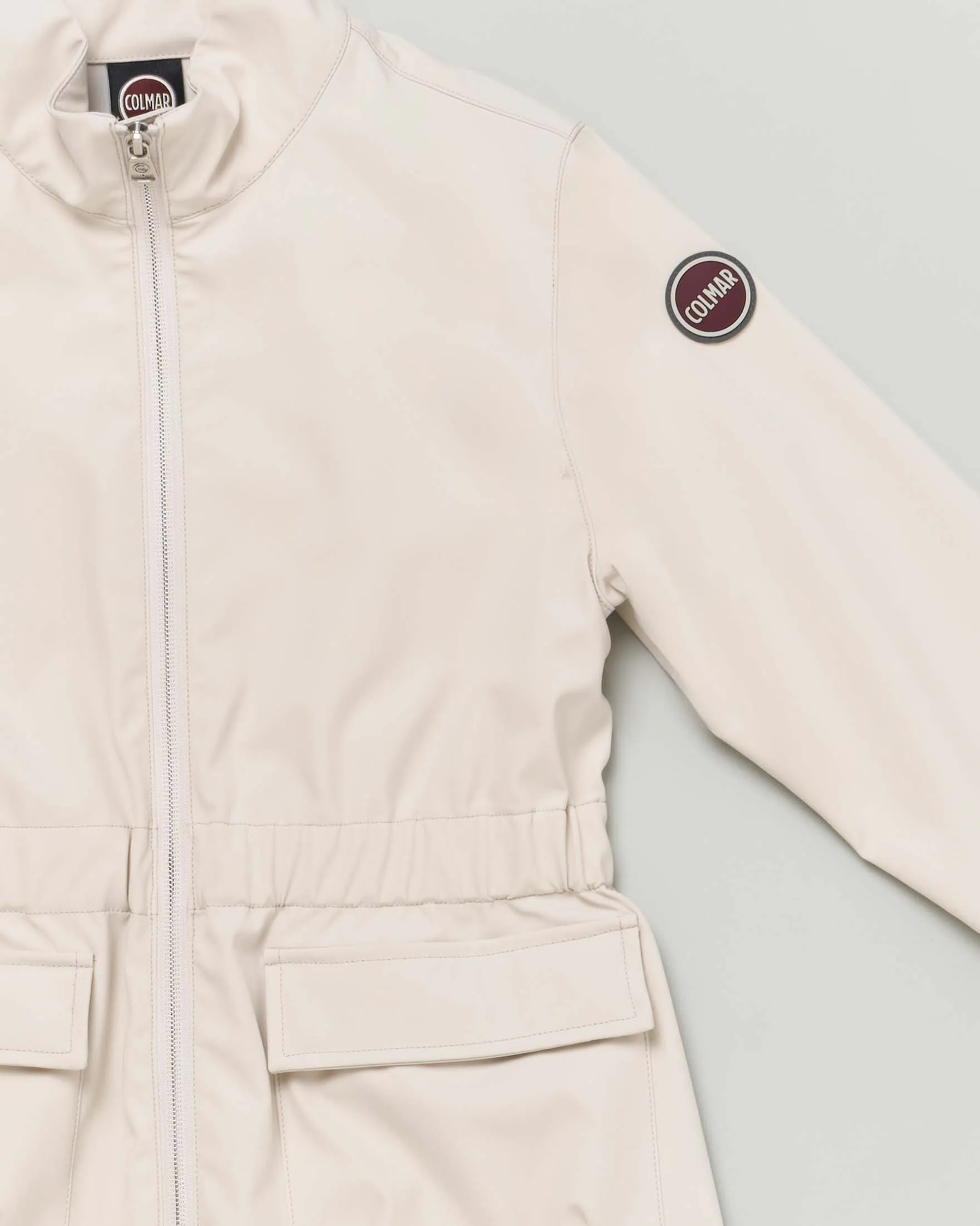 Sahariana beige in softshell con elastico inserito in vita e collo alto 12-14 anni